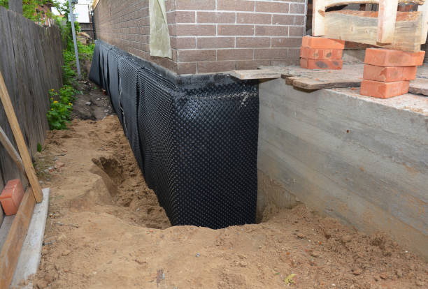 SJ Waterproofing Pros technician performing targeted Exterior Waterproofing assessment in Brohman, MI